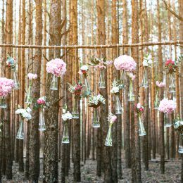 Wedding flowers decoration arch in the forest. The idea of a wedding flower decoration. wedding concept in nature.